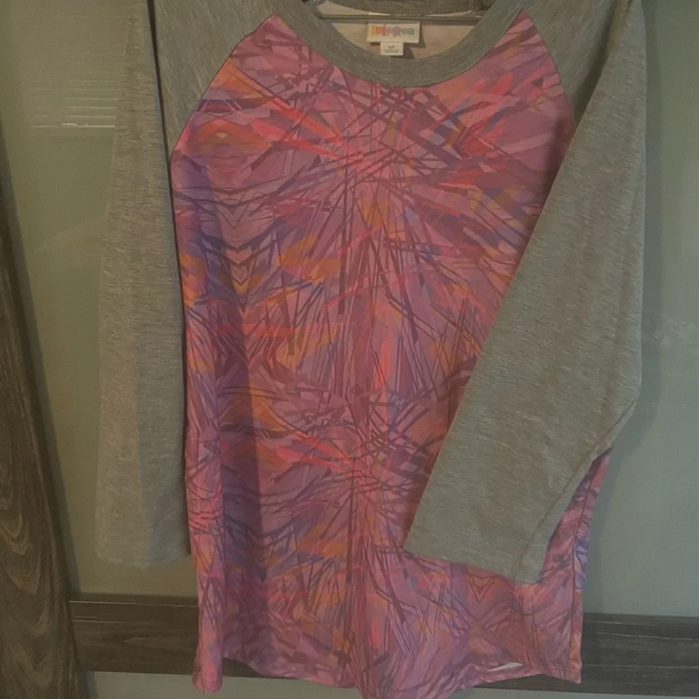 2- Lularoe Randy shirts. Disney print NWT and pink gently used. - Picture 6 of 6